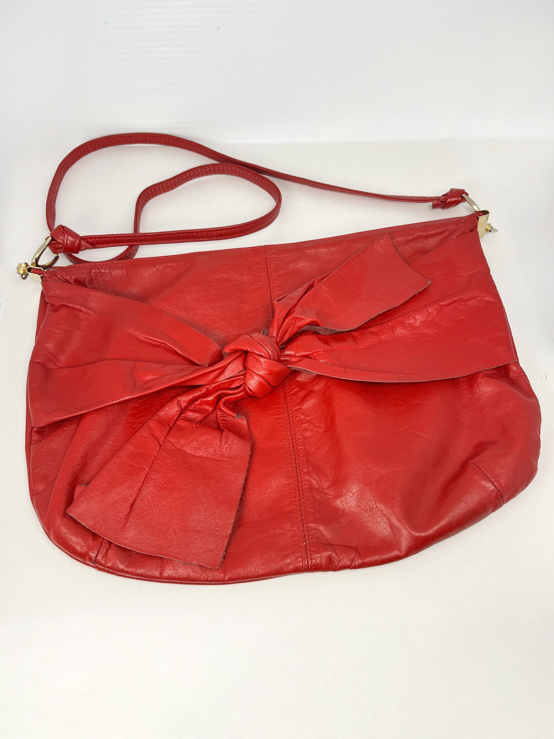 Vintage red leather 80s style purse with bow tie