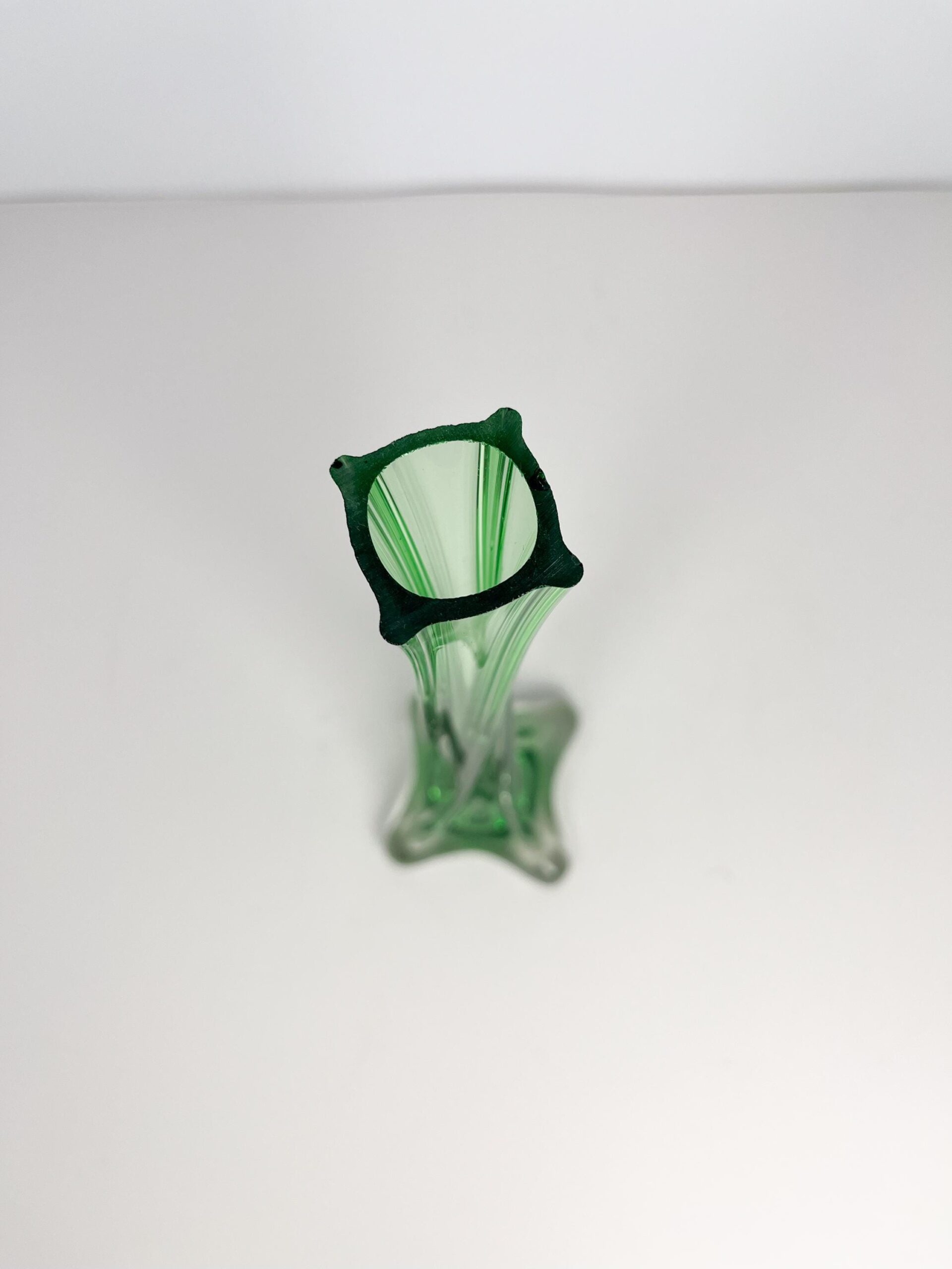 Vintage MCM emerald green art glass bud vase - twisted glass, footed